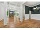 Spacious living room with hardwood floors, coffered ceiling, fireplace, and natural light at 5705 Twelve Oaks Dr, Cumming, GA 30028