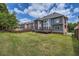 Expansive backyard featuring lush lawn and exterior view of the home at 9843 Talisman Dr, Alpharetta, GA 30022