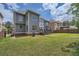 Well-maintained backyard with lush lawn and partial view of the home's exterior at 9843 Talisman Dr, Alpharetta, GA 30022