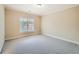 Bedroom features carpeting, a window, and neutral paint at 9843 Talisman Dr, Alpharetta, GA 30022