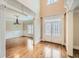 Inviting foyer with hardwood floors, elegant moldings, and a view into the adjacent dining room at 9843 Talisman Dr, Alpharetta, GA 30022
