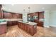 Spacious kitchen with granite countertops, stainless steel appliances, and a large central island with a cooktop at 9843 Talisman Dr, Alpharetta, GA 30022