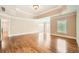 Spacious main bedroom has a trey ceiling, hardwood floors, and plenty of natural light at 9843 Talisman Dr, Alpharetta, GA 30022