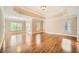 Large main bedroom features a trey ceiling, windows, and hardwood flooring at 9843 Talisman Dr, Alpharetta, GA 30022
