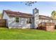 Backyard with a deck attached to the house and green grass at 1181 Mannbrook Dr, Stone Mountain, GA 30083