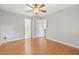 This bedroom features hardwood flooring and two doors at 1181 Mannbrook Dr, Stone Mountain, GA 30083