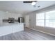 Bright kitchen featuring white cabinets, stainless steel appliances, and ample natural light from large windows at 1181 Mannbrook Dr, Stone Mountain, GA 30083