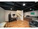Spacious finished basement area with stairs, desk, and workout equipment at 1907 Shalimar Ne Dr, Atlanta, GA 30345