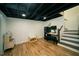 Spacious finished basement area with stairs, desk, and playroom at 1907 Shalimar Ne Dr, Atlanta, GA 30345