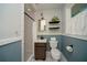 Stylish bathroom featuring a tiled shower, patterned floor, floating shelves and stylish finishes at 1907 Shalimar Ne Dr, Atlanta, GA 30345