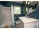 Bathroom with vanity, bath, and stylish blue shiplap at 1907 Shalimar Ne Dr, Atlanta, GA 30345
