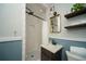 Contemporary bathroom with a tiled shower, floating shelves, and elegant fixtures at 1907 Shalimar Ne Dr, Atlanta, GA 30345