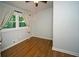 Bright bedroom features hardwood floors and natural light from a large window at 1907 Shalimar Ne Dr, Atlanta, GA 30345