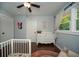 A Bedroom featuring hardwood floors, a white dresser, and ample natural light at 1907 Shalimar Ne Dr, Atlanta, GA 30345