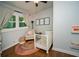 Bright Bedroom with hardwood floors, rug, and white crib at 1907 Shalimar Ne Dr, Atlanta, GA 30345
