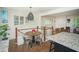 Cozy dining area with modern decor, stainless chairs, and a view into the living space at 1907 Shalimar Ne Dr, Atlanta, GA 30345