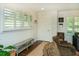 Entryway with white shutters, neutral walls, bench, and natural light at 1907 Shalimar Ne Dr, Atlanta, GA 30345