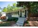Charming one-story home with blue brick, a wreath on the door, and lush landscaping at 1907 Shalimar Ne Dr, Atlanta, GA 30345