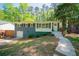 Charming home with a blue brick exterior, landscaped front yard, and inviting entrance at 1907 Shalimar Ne Dr, Atlanta, GA 30345