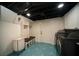 Laundry room with washer, dryer, shelving, and unique, patterned tile flooring at 1907 Shalimar Ne Dr, Atlanta, GA 30345