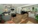 Open-concept living room with hardwood floors seamlessly connected to the modern kitchen at 1907 Shalimar Ne Dr, Atlanta, GA 30345