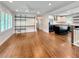 Open-concept living room with hardwood floors, a ceiling fan, and an eat-in kitchen with an island and stainless appliances at 1907 Shalimar Ne Dr, Atlanta, GA 30345