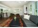Open living room features large windows, wood floors, and seamless flow to the dining area at 1907 Shalimar Ne Dr, Atlanta, GA 30345