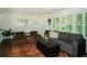 Bright living room with large windows, hardwood floors, and a comfortable seating arrangement at 1907 Shalimar Ne Dr, Atlanta, GA 30345