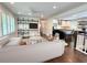 Bright open-concept living room with modern shelving and an eat-in kitchen with an island and barstool seating at 1907 Shalimar Ne Dr, Atlanta, GA 30345