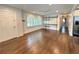 Bright living room featuring hardwood floors, shuttered windows, and open floor plan at 1907 Shalimar Ne Dr, Atlanta, GA 30345