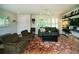 Inviting living room with a decorative rug, and ample natural light from the shuttered windows at 1907 Shalimar Ne Dr, Atlanta, GA 30345