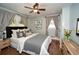 Charming bedroom with a ceiling fan, hardwood floors, and plenty of natural light at 1907 Shalimar Ne Dr, Atlanta, GA 30345