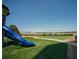 Playground with slide and swings on a sunny day with clear blue skies at 1907 Shalimar Ne Dr, Atlanta, GA 30345