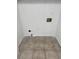 Neutral-toned tiled laundry room with white walls, outlet, and water hookups ready for a washer and dryer at 2080 Charter Ln, Lithonia, GA 30058