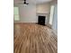 Living room featuring a fireplace and a ceiling fan in a room with lots of natural light at 2080 Charter Ln, Lithonia, GA 30058