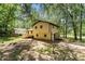 Expansive backyard with mature trees at 240 Wellington Dr, Mcdonough, GA 30252