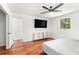 Bedroom with two dressers and a mounted television at 240 Wellington Dr, Mcdonough, GA 30252