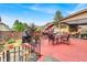 Inviting backyard patio with dining area and hammock under covered porch at 3259 Baylor Cir, Mcdonough, GA 30253