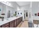 Bathroom featuring a long vanity with double sinks and nice tiling at 3259 Baylor Cir, Mcdonough, GA 30253