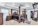 Spacious bedroom featuring tray ceilings, four poster bed, and walk-in closet at 3259 Baylor Cir, Mcdonough, GA 30253