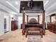 Spacious bedroom featuring tray ceilings, four poster bed, and walk in closet at 3259 Baylor Cir, Mcdonough, GA 30253