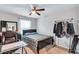 Bedroom boasts a bed, TV, and a clothing rack providing ample storage at 3259 Baylor Cir, Mcdonough, GA 30253