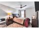Bedroom features a cozy bed, ceiling fan, and stylish furniture at 3259 Baylor Cir, Mcdonough, GA 30253