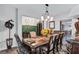 Spacious dining area with decorative accents, ample seating, and an open design to foyer and living spaces at 3259 Baylor Cir, Mcdonough, GA 30253
