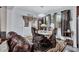 Cozy dining area featuring wood furniture, natural light, and a seamless transition to a casual seating area at 3259 Baylor Cir, Mcdonough, GA 30253
