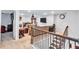 Living room area showcasing plush seating, TV, and stairway access at 3259 Baylor Cir, Mcdonough, GA 30253