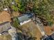 Aerial view showcasing the home's location, driveway, and mature trees on a spacious lot at 3406 Jackson Dr, Decatur, GA 30032