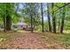 Expansive backyard with a deck, perfect for entertaining and enjoying the outdoors, with mature trees at 3406 Jackson Dr, Decatur, GA 30032