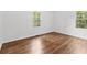 Bright bedroom with hardwood floors, with natural light from two windows at 3406 Jackson Dr, Decatur, GA 30032