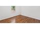 Bedroom features hardwood floors, a window, and neutral decor at 3406 Jackson Dr, Decatur, GA 30032